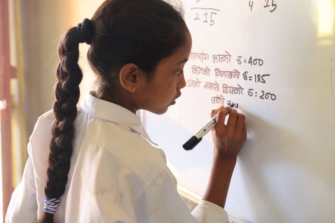 Kriti Pandit, a sixth grader at the Shree Janata Rashtriya Primary School in Bode Barsain Municipality in Saptari District in Nepal's southern plains. Credit: UNICEF/UNI448464/Laxmi-Prasad-Ngakhusi